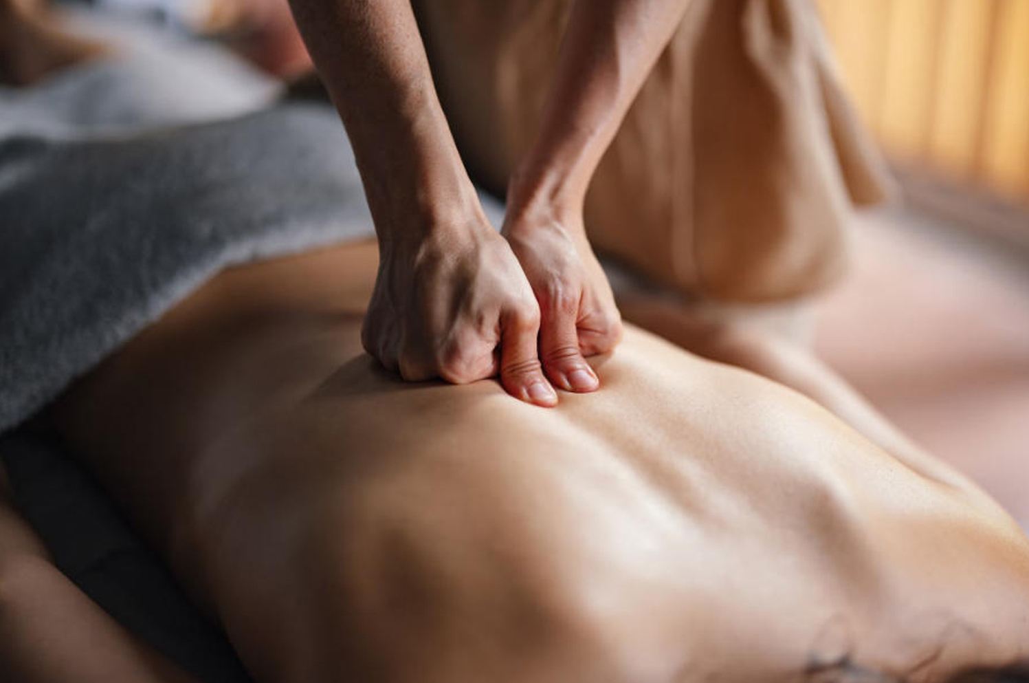 Therapist applying focused pressure on shoulders during a Stress Relief massage at Blue Bay SPA Winter Park